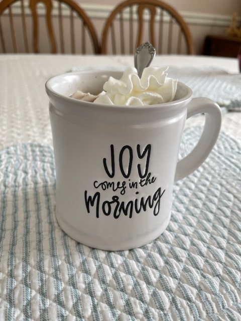 Coffee Mug with Joy Comes in the Morning written on it